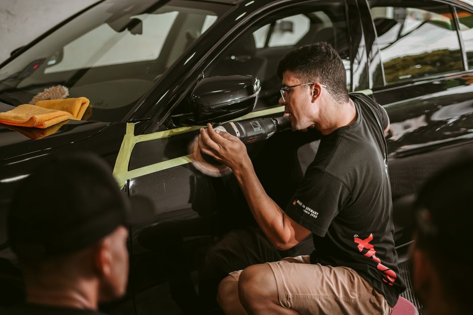 Man polishing car exterior